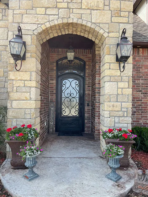 Traditional iron door with sidelights